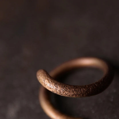 Curved solid copper ring