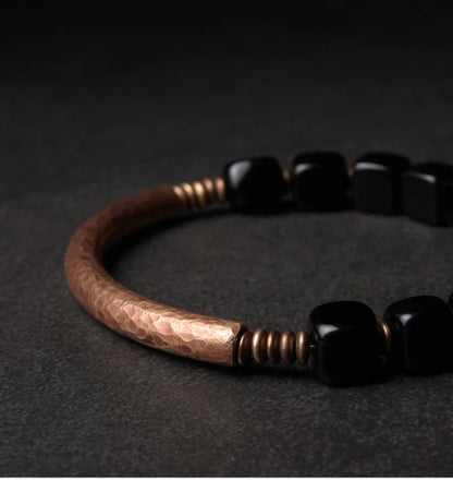 Cubic black obsidian and copper: protection and self-confidence