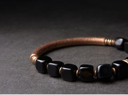 Cubic black obsidian and copper: protection and self-confidence