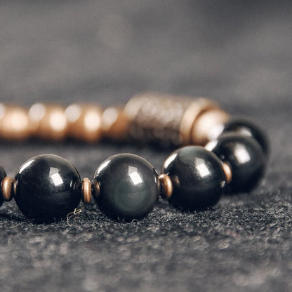 Obsidian beads and hammered brass: protection and serenity